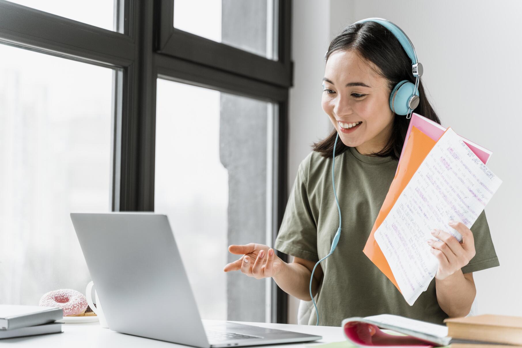 woman-with-headphones-having-video-call-laptop (1)
